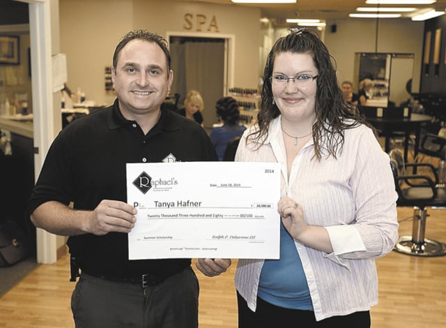 Ralph Delserone, owner, presenting 2014 Scholarship Winner, Tanya Hafner with her scholarship certificate.