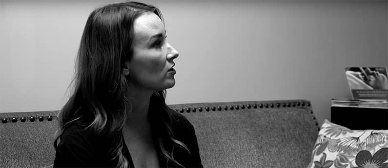 A Woman being interview. Black and white photo. Check out this beauty school in Ohio.