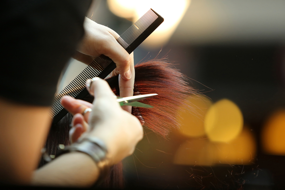 hairdresser trimming hair