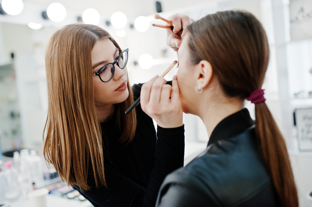 makeup artist applying makeup