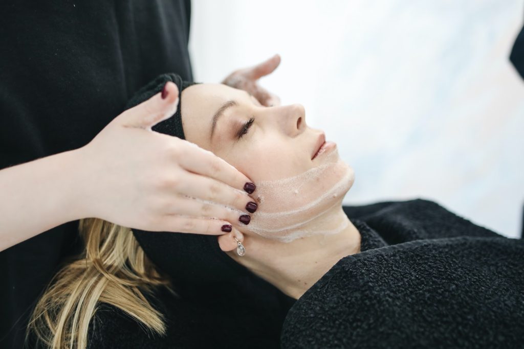 woman receiving a facial service